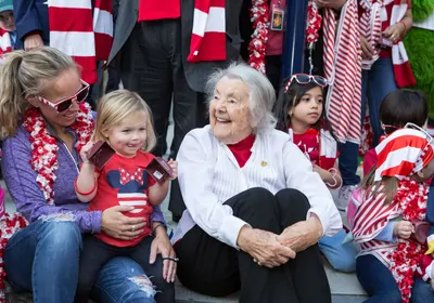Happy woman surrounded by children Happy woman surrounded by children